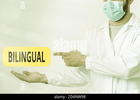 Word writing text Bilingual. Business photo showcasing using or able to use two languages especially with equal fluency Displaying Empty Sticker Paper Stock Photo