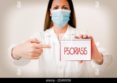 Writing note showing Psoriasis. Business concept for chronic skin disease characterized by patches with white scales Laboratory technician featuring e Stock Photo