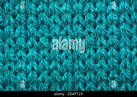 Blue synthetic knitted fabric close up. Knitted fabric texture background Stock Photo
