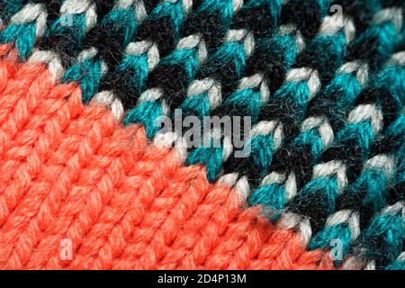 Colorful synthetic knitted fabric close up. Patterned knitted fabric texture background Stock Photo