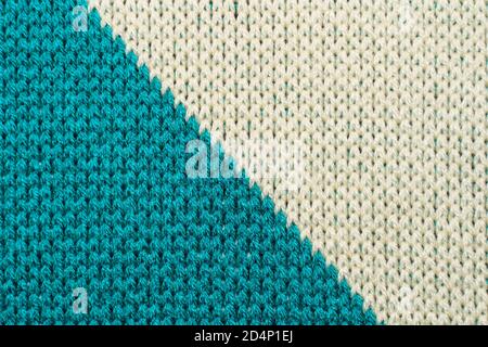 Blue and white synthetic knitted fabric close up. Knitted diagonal pattern fabric texture background Stock Photo