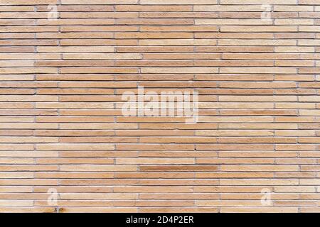 New, rustic brown and beige brick or tile wall. High quality texture and background for your projects and creative work Stock Photo