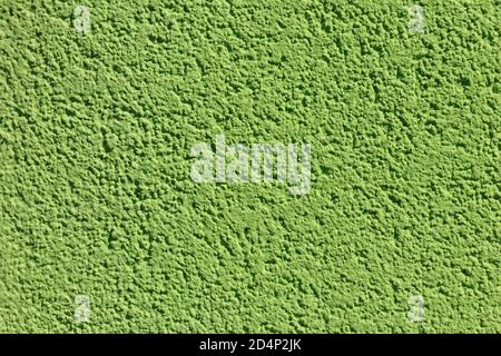 Decorative green plaster texture on the wall. Texture of the green stucco wall for background Stock Photo