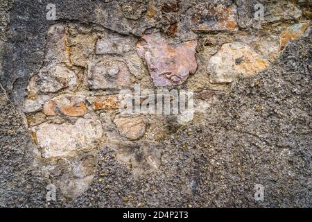 Old, rustic corroded and damaged brick wall. High quality texture and background for your projects and creative work Stock Photo