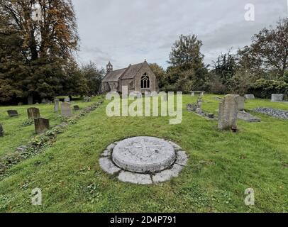 Memorial of novelist, historian and politician, John Buchan, 1st Baron Tweedsmuir, in the churchyard at Elsfield, Oxfordshire, UK Stock Photo