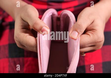 women hand open an empty wallet top down  Stock Photo