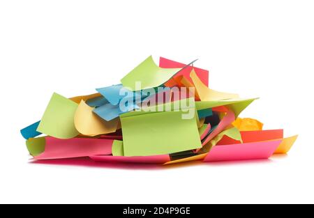 Used colorful stickers notes heap isolated on white. Side view. Stationery colored sticky notes. Stock Photo