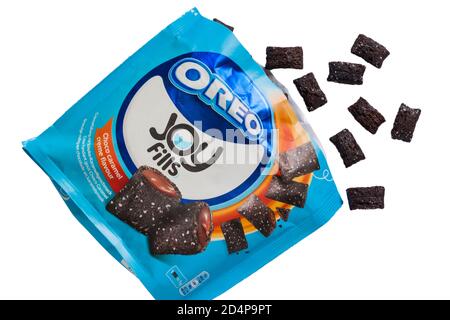 Packet of Oreo Joy Fills Choco caramel creme flavour crispy and creamy opened with contents spilled spilt set on white background - Oreos Stock Photo
