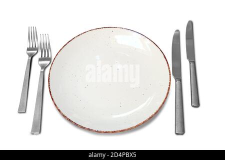 Set of luxurious Silverware and nice empty round plate isolated on white Stock Photo