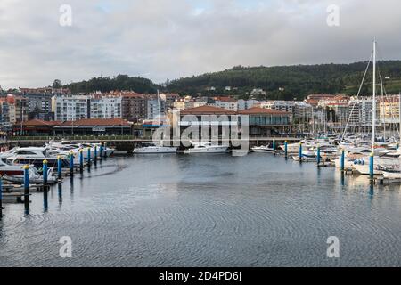 SANXENXO, SPAIN - AUGUST 18, 2020: Small sailing boats moored in the yacht club of Sanxenxo on a clear Summer day, Pontevedra, Spain. Stock Photo