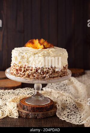 Homemade hummingbird cake with pineapple flowers on top with copy space Stock Photo