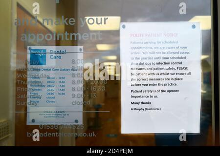 Security notice in the window of a dental surgery at a shopping centre, Corby, Northants, England, during the coronavirus crisis, October 2020. Stock Photo