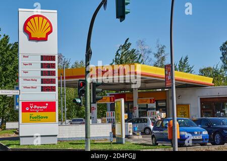 Berlin, Germany - September 17, 2020: View to a Shell Group petrol station with price board and building. Stock Photo