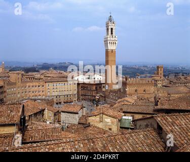 Italy. Tuscany region. Siena. Medieval buildings around Campo Square with Mangia Tower. Stock Photo