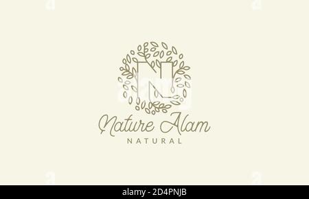 initial N or letter N with leaf  ornament on circle luxury modern logo vector icon illustration design Stock Vector