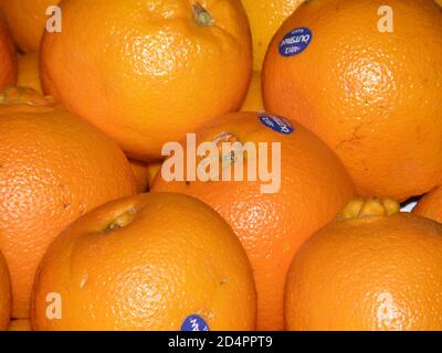 Ripened naval oranges at a farm stand. Stock Photo