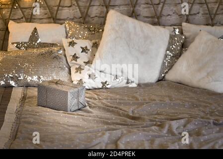 Cozy bed with Christmas pillows decorated with Christmas decor Stock Photo  - Alamy