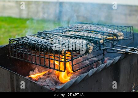 fish, mackerel roasting on the barbecue grill Stock Photo