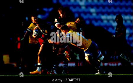 Exeter Chief's Henry Slade (left) is tackled during the Gallagher Premiership semi final match at Sandy Park, Exeter. Stock Photo