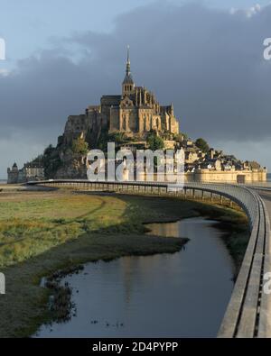 Le Mont-Saint-Michel with pedestrian bridge, Manche department, Normandy, France, Europe Stock Photo