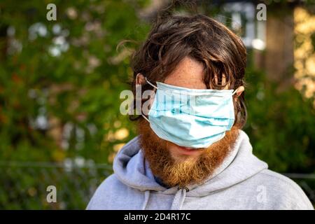 Man wearing a mask over his eyes Stock Photo - Alamy