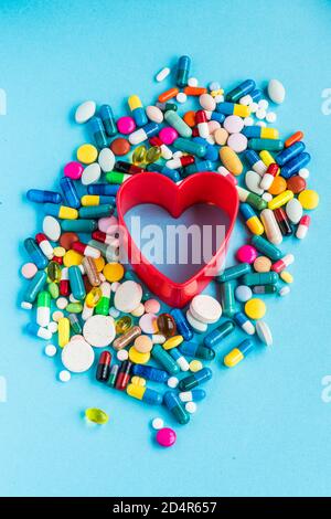 Generic pills and capsules in heart shape. Stock Photo