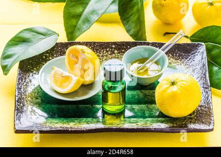 Yuzu essential oil (Citrus Junos). Stock Photo