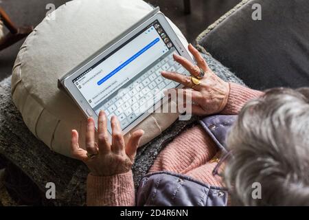 Woman using a digital tablet. Stock Photo