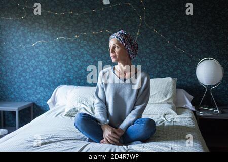 Woman undergoing chemotherapy practicing respiratory exercises. Stock Photo