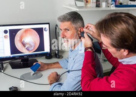 Video otoscopy , diagnosis of otitis externa or average. Stock Photo