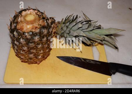 Cut Pineapple and Chef Knife Stock Photo