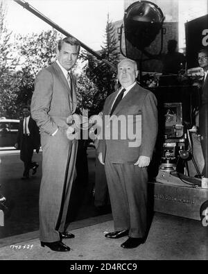 CARY GRANT and ALFRED HITCHCOCK with Camera Crew on set location candid outside the Hotel Plaza in New York City filming NORTH BY NORTHWEST 1959 director ALFRED HITCHCOCK writer Ernest Lehman music Bernard Herrmann Metro Goldwyn Mayer Stock Photo