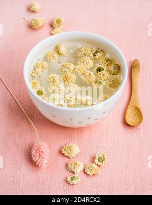 Herbal tea of dry blossoms of camomile (Anthemis nobilis). Stock Photo