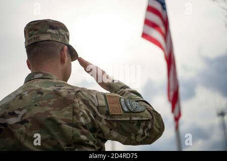 U.S. Air Force Lt. Col. Paul Weme, NATO Headquarters Sarajevo executive officer, salutes the American flag during a Veterans Day ceremony at Camp Butmir, Bosnia-Herzegovina, Nov. 11, 2019. The U.S. contingent gathered at the Camp Butmir Memorial Park to pay tribute to American veterans, past and present. (U.S. Air Force photo by Staff Sgt. Victor J. Caputo) Stock Photo