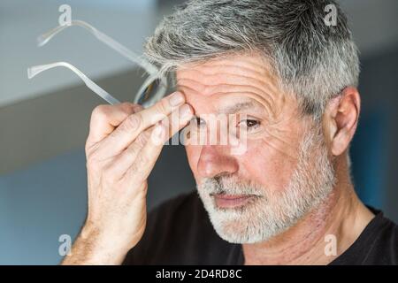 Man suffering from headache. Stock Photo