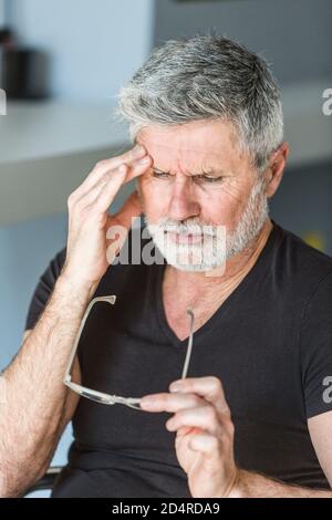 Man suffering from headache. Stock Photo