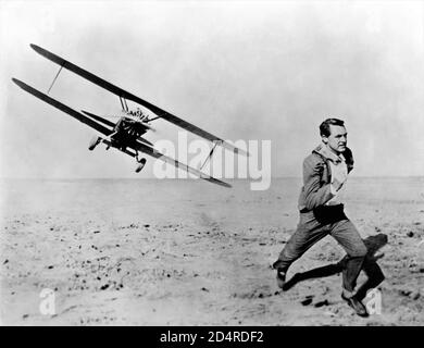 CARY GRANT being chased by Crop Dusting Plane in NORTH BY NORTHWEST 1959 director ALFRED HITCHCOCK writer Ernest Lehman music Bernard Herrmann Metro Goldwyn Mayer Stock Photo