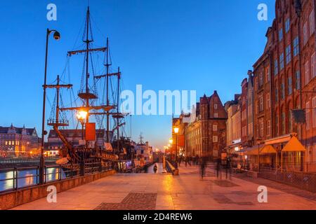 Night scene along the quai in Gdansk (Danzig), Poland, featuring the Black Pearl, a historical ship permanently moored in the city. Stock Photo