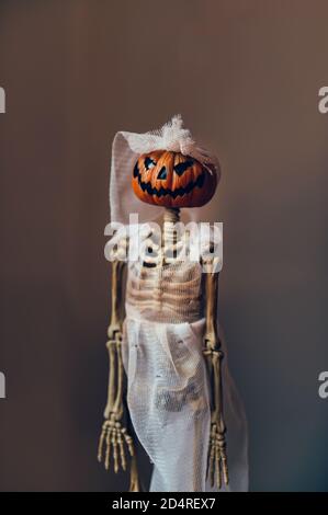 Skeleton with pumpkin head in bridal oufit Stock Photo