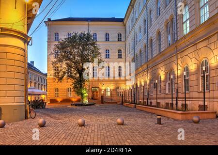 Night scene in the old town of Timisoara, Romania along the General Traian Doda street, just off the Eugeniu de Savoya street, featuring the recently Stock Photo