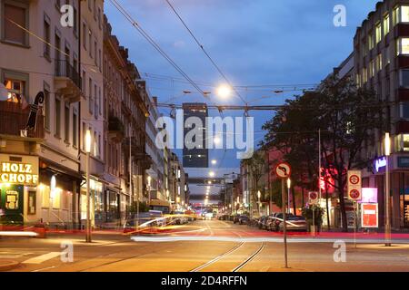 Street scene in downtown Basel, Switzerland with Basler Messeturm (Basel Trade Fair Tower). Stock Photo