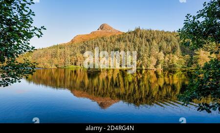 the Pap of Glencoe is a familiar landmark around the lower end of the glen and Loch Leven. Seen here with beautiful reflections Stock Photo