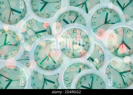 Composition with many clocks with lights, glitters and reflections Stock Photo