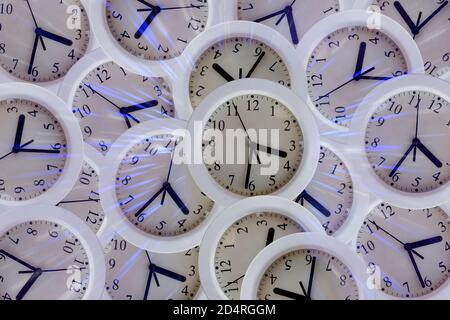 Composition with many clocks with lights, glitters and reflections Stock Photo