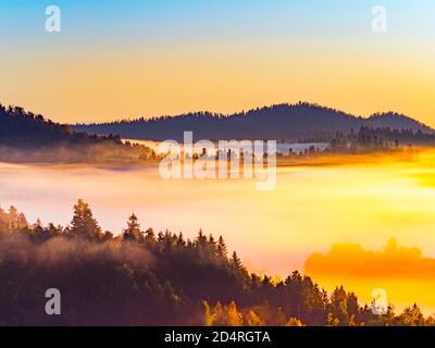 Spectacular dreamy dramatic sunrise early morning dawn moments with fog in Gorski kotar county region in Croatia Europe near Mrzla vodica Stock Photo