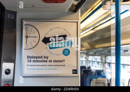 Delay repay advertisement inside UK train for delays more than 15 minutes Stock Photo