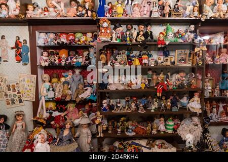 South Park City, Colorado - September 16, 2020: Hundreds of vintage dolls and toys displayed on a shelf Stock Photo