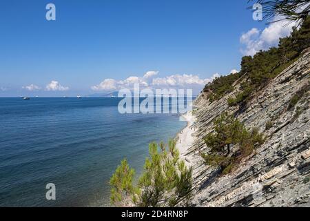 Summer landscape. A picturesque stone wild beach at the foot of the rocks in the immediate vicinity of the resort of Gelendzhik Stock Photo