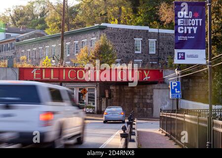 Ellicott City, MD, USA 10/07/2020: Welcome to Ellicott City sign written in large capital letters on side of the B&O railroad bridge at the entrance o Stock Photo