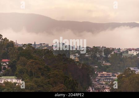 Thick monsoon clouds hangs over Shillong city, Meghalaya, India. A wide angle shot of overcast sky during monsoon season in India. Stock Photo